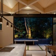 Kitchen with exposed timber diagrid roof in Arbour House by Andrei Saltykov