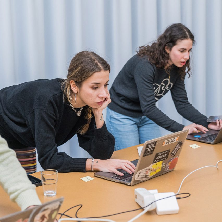 people working on a laptop