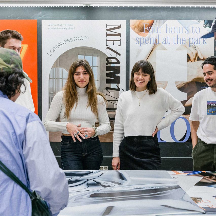 people standing in front of posters
