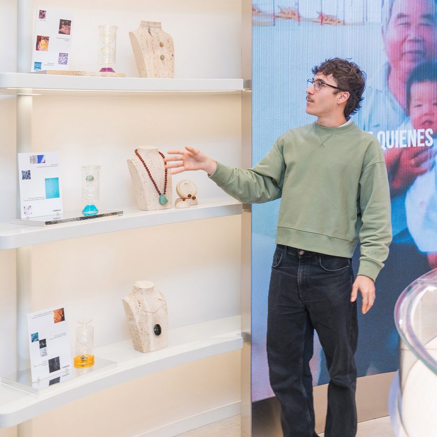 person standing in front of jewellery display