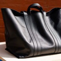 Photo of a large black tote bag by BEEN London in a soft and supple black material that looks like leather but is actually New Grain by Arda