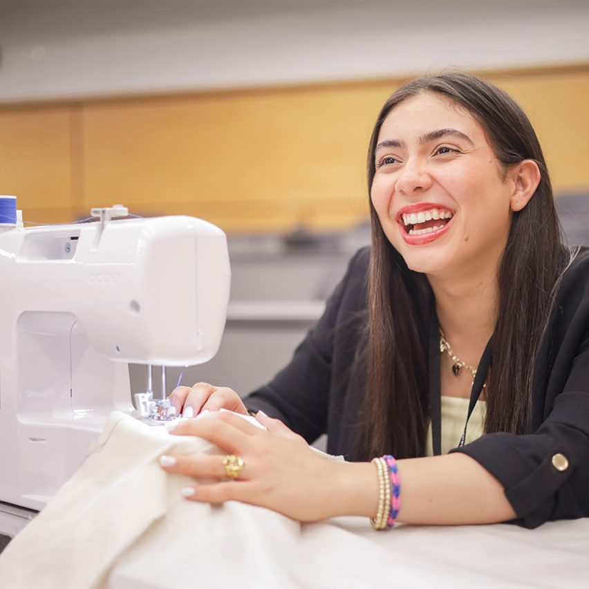 person using a sewing machine