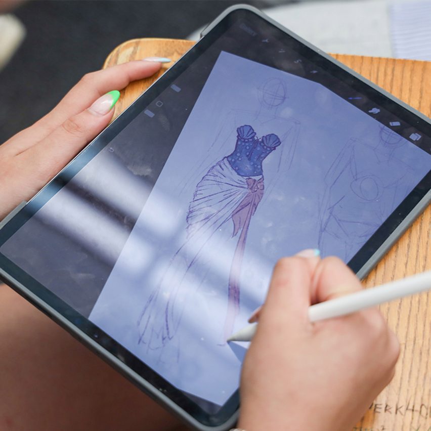 person drawing on a tablet