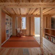 Sliding bookshelf walls in Live Sawn House by ICADA