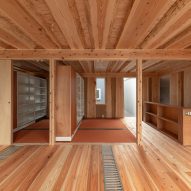 Sliding bookshelf walls in Live Sawn House by ICADA