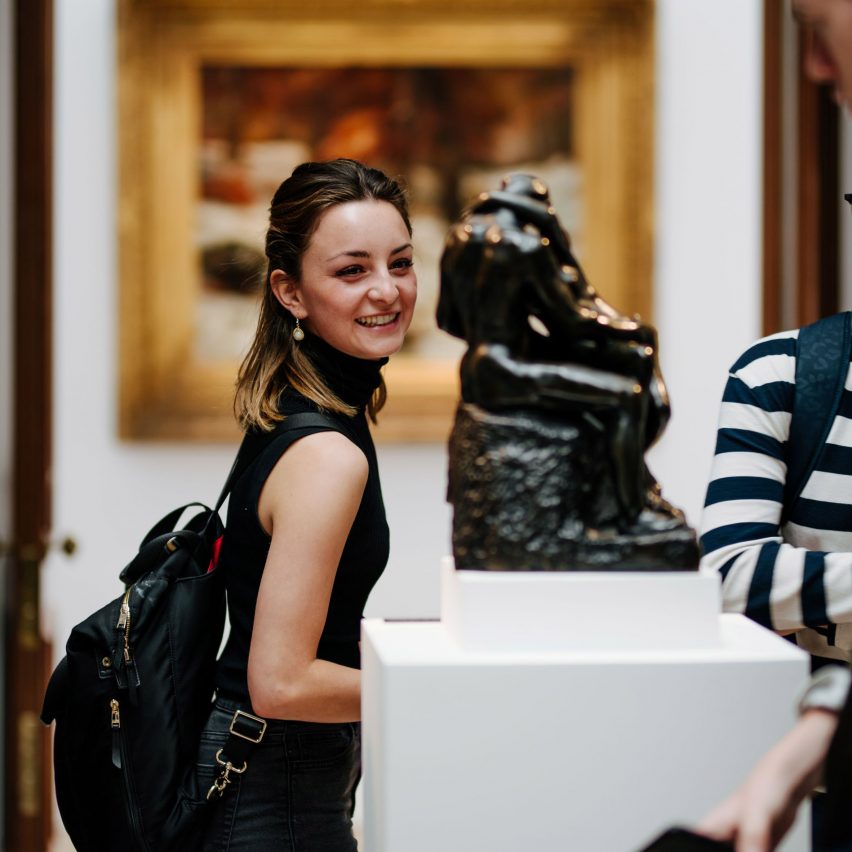 person looking at art in gallery