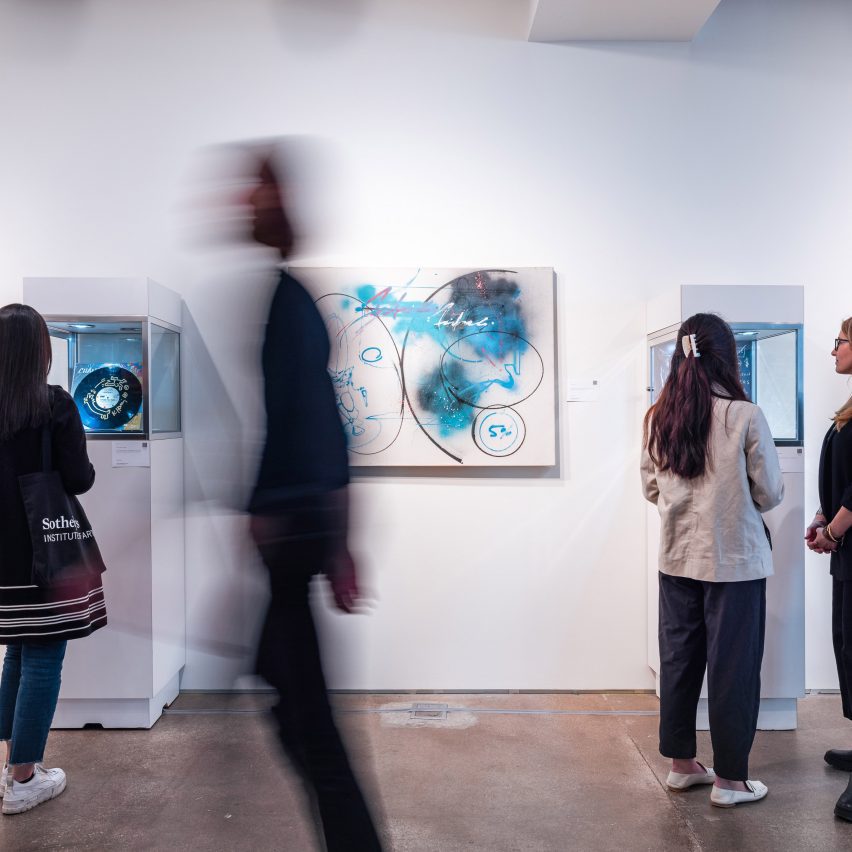 people standing in an art gallery
