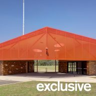 Ancient clay ovens inform red-toned sports pavilion by Sam Crawford Architects