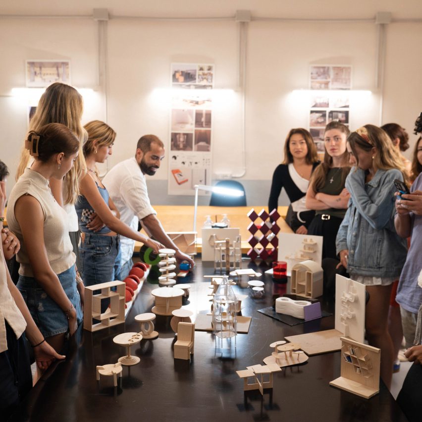 students presenting furniture designs to one another