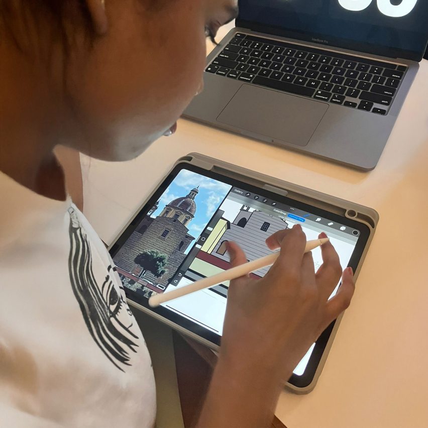 a person drawing on a digital tablet