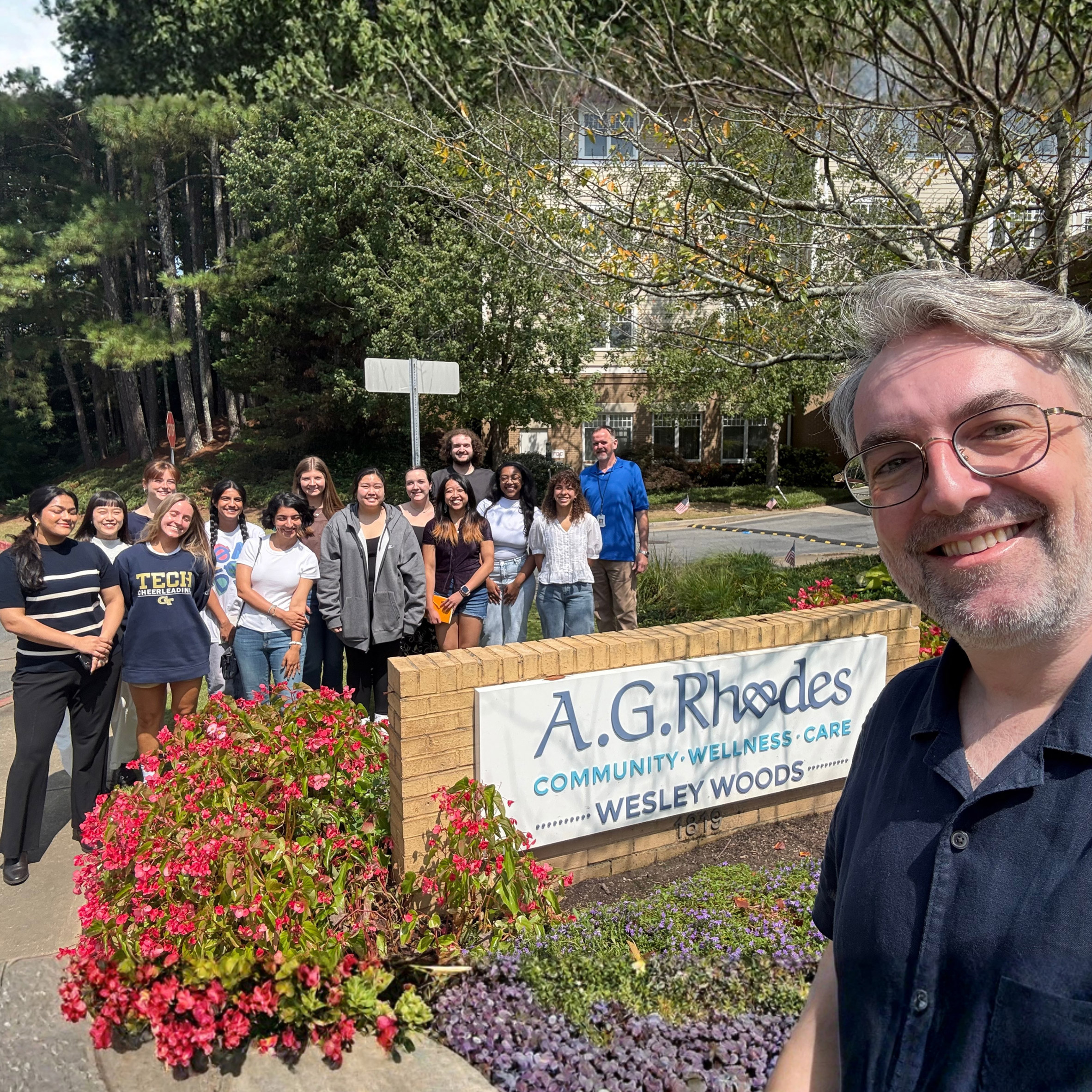 a photograph of a lecturer and students