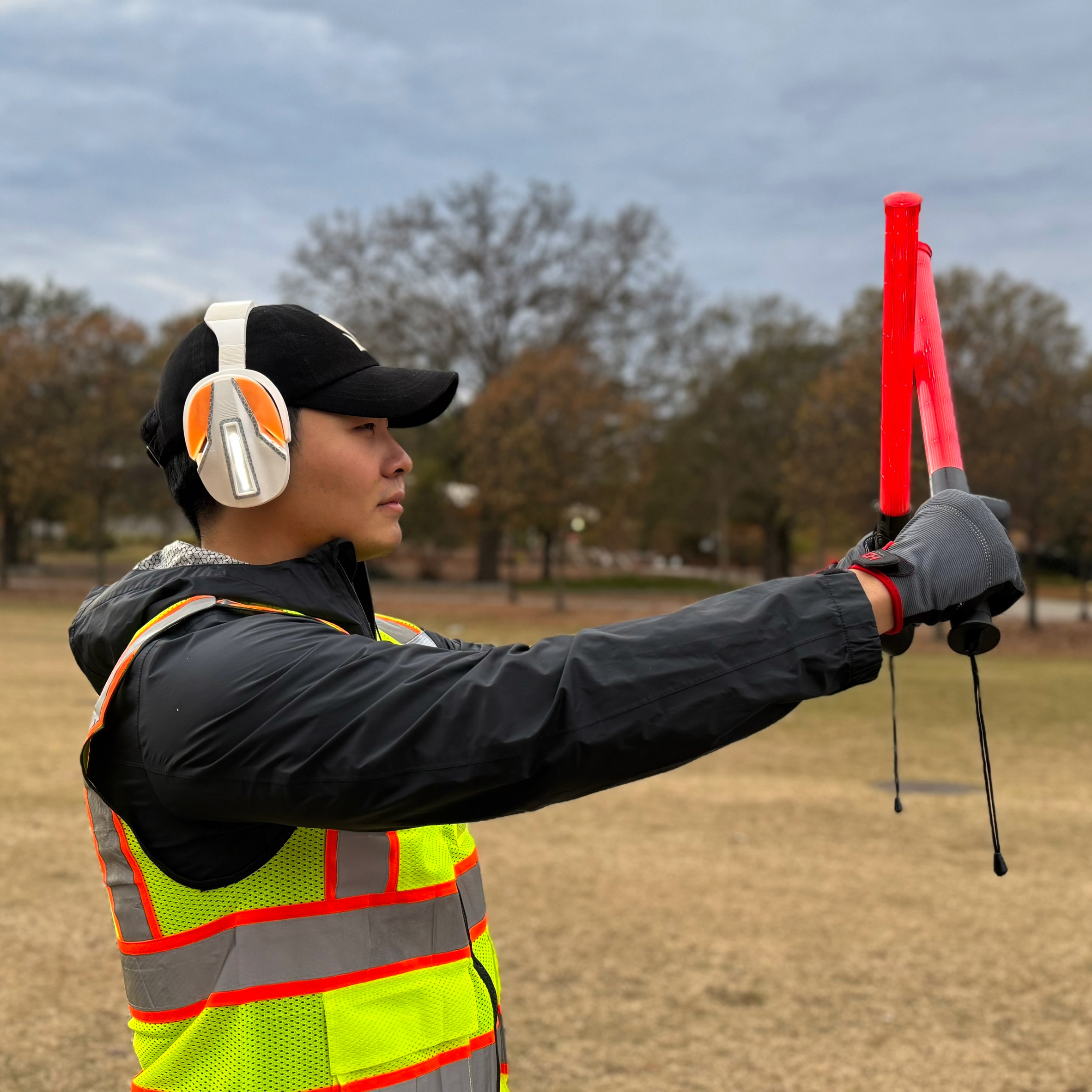 a photograph of a person in a high-vis jacket