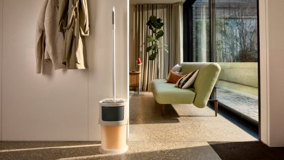 UltraClean mop and bucket stored in a compact corner of a living space