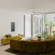 Living room with green sofa