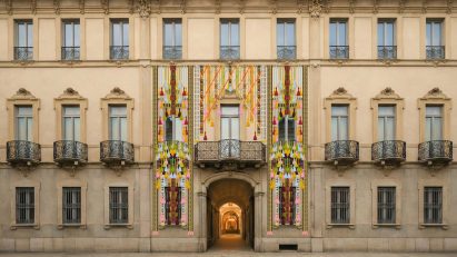 Textile installations hanging across the facade of Palazzo Citterio in Milan