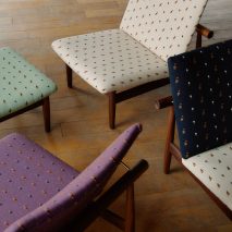 an image of chairs in tones of white, green, blue and pink