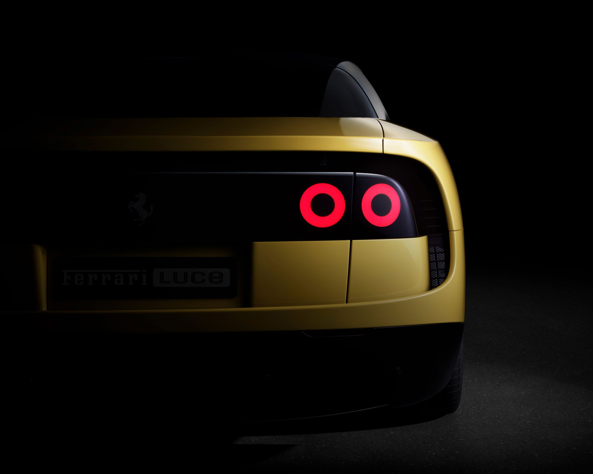 Rear view of yellow Ferrari Luce tail lights