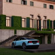 Rear three-quarter view of blue Ferrari Luce