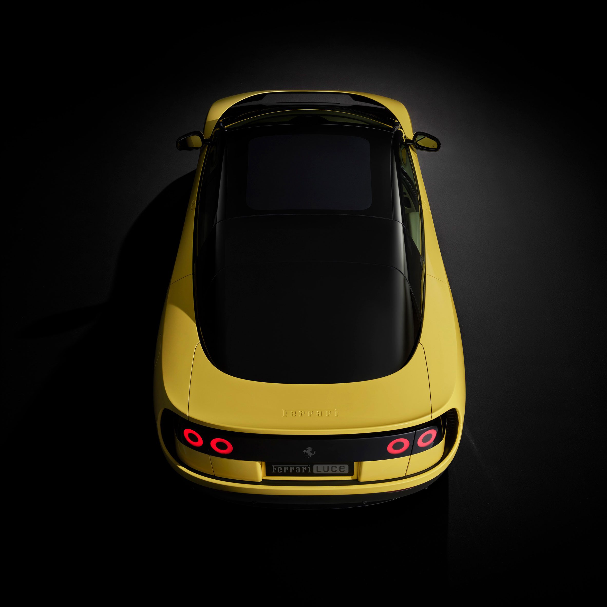 Rear view of yellow Ferrari Luce