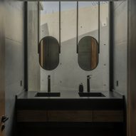 Casa Alba by Ademas Arquitectura, a concrete house with a wall for privacy