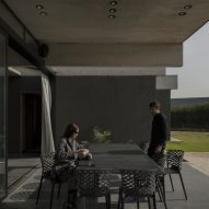 Casa Alba by Ademas Arquitectura, a concrete house with a wall for privacy