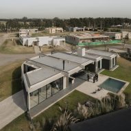 Casa Alba by Ademas Arquitectura, a concrete house with a wall for privacy
