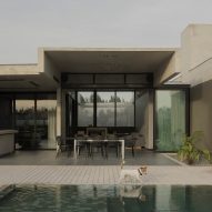 Casa Alba by Ademas Arquitectura, a concrete house with a wall for privacy