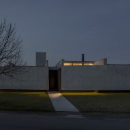 Casa Alba by Ademas Arquitectura, a concrete house with a wall for privacy
