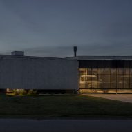 Casa Alba by Ademas Arquitectura, a concrete house with a wall for privacy