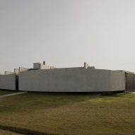Casa Alba by Ademas Arquitectura, a concrete house with a wall for privacy