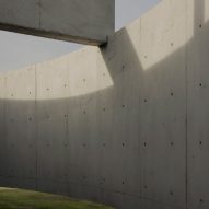 Casa Alba by Ademas Arquitectura, a concrete house with a wall for privacy