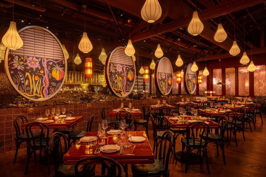 Restaurant interior where ceiling trusses are coated in sound- and light-absorbing, tinted natural cork