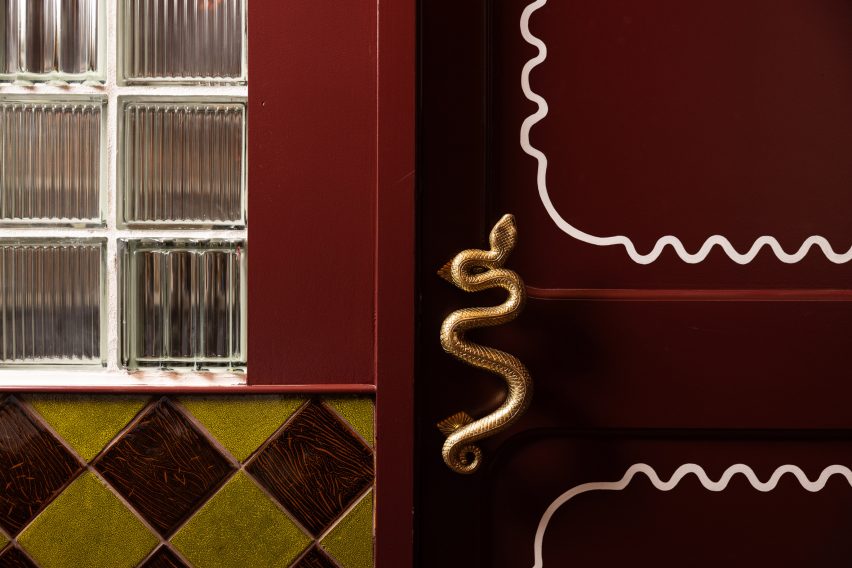 A serpent-shaped door handle