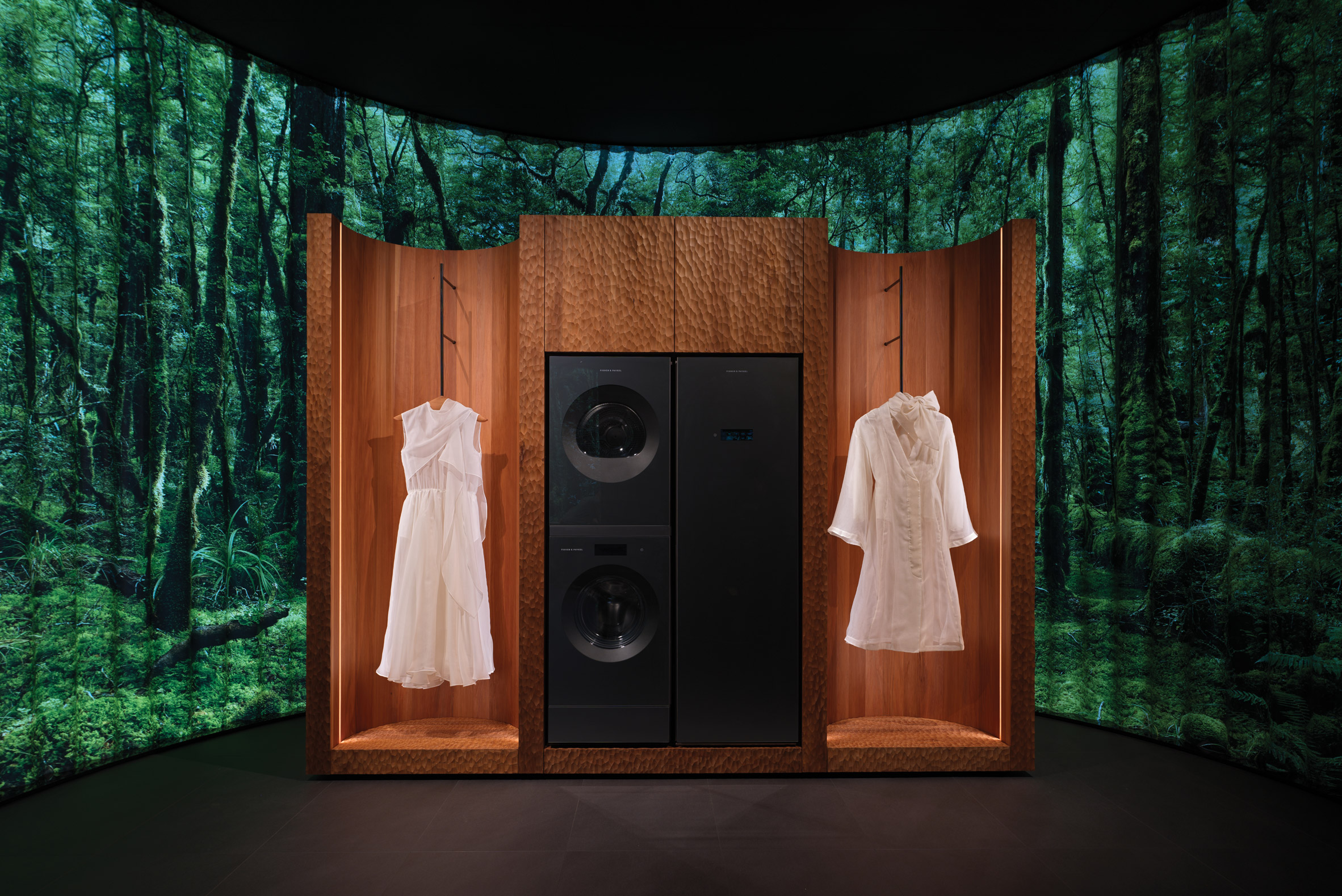 Clothes in front of wooden cabinets