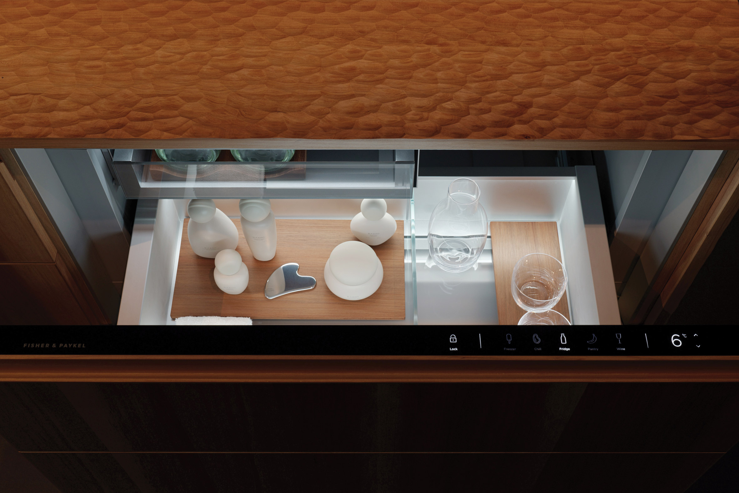 Skincare products in wooden drawer