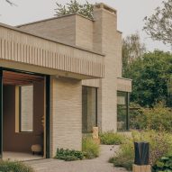 House of EM draws on mid-century design principles for brick-clad home