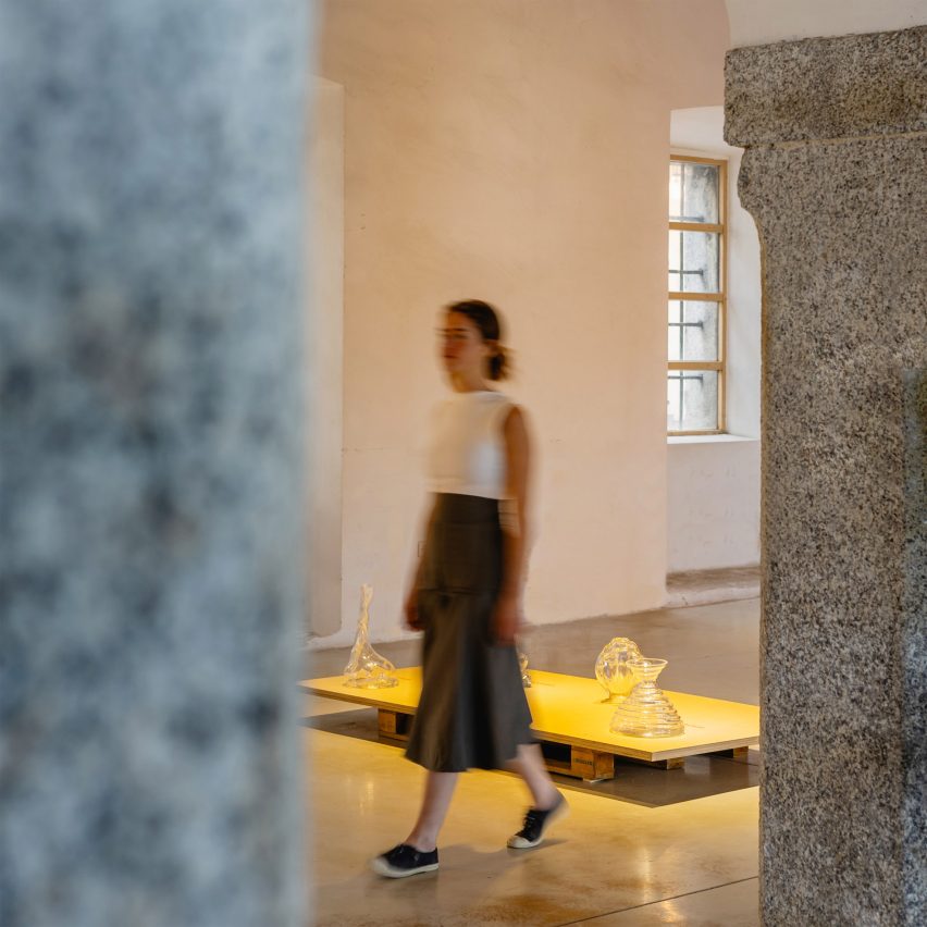a person walking through a gallery