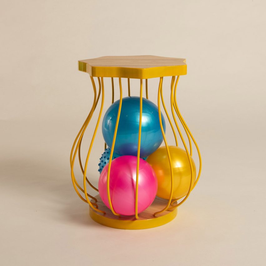 a stool in tones of yellow, blue and pink