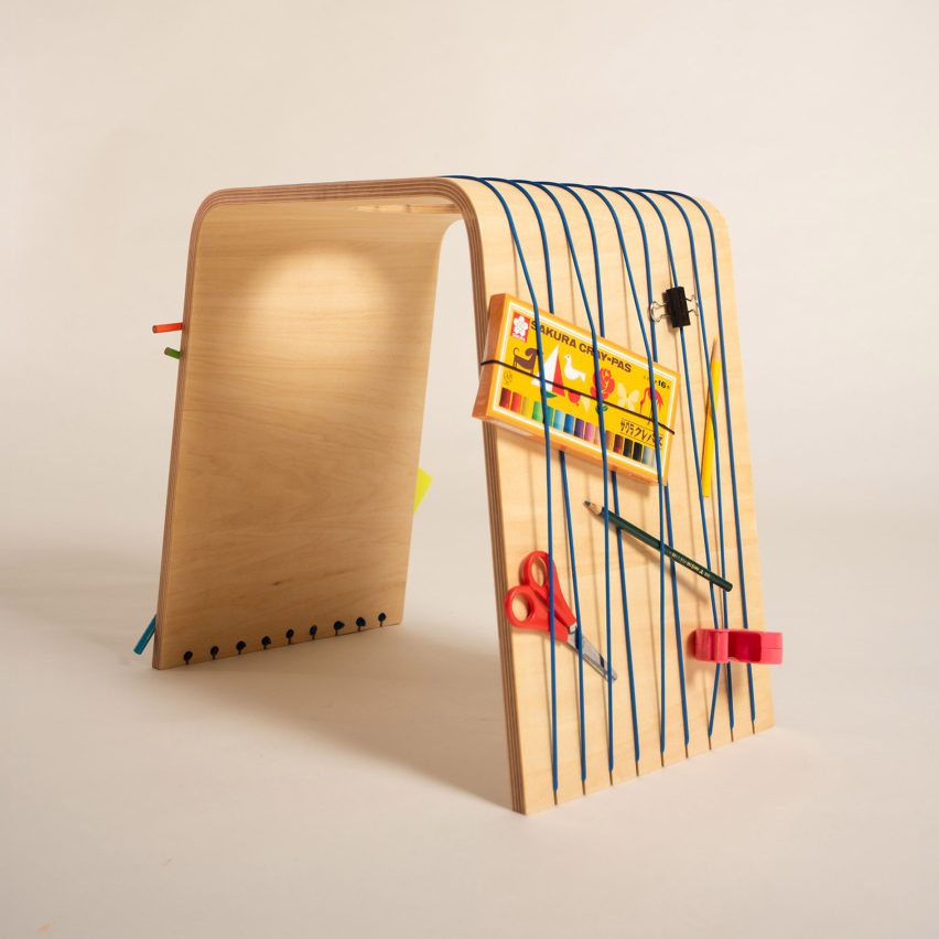 a wooden stool with storage for craft tools