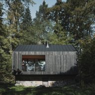 Log cabin on stone plinth in Czech Republic