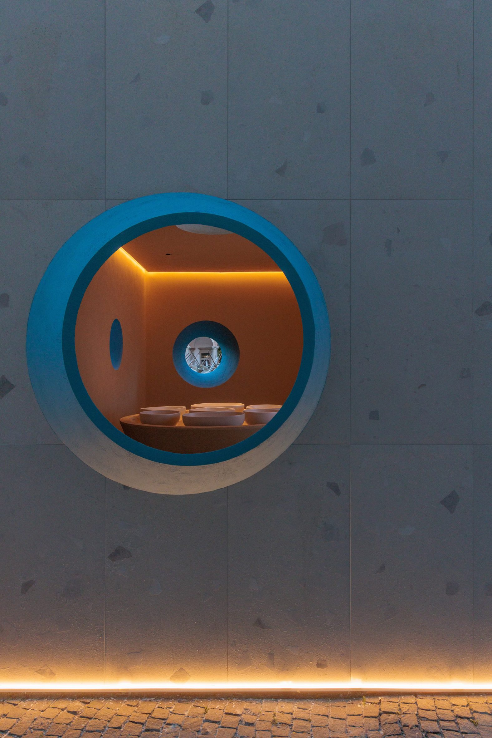View of interior of structure seen through a round window