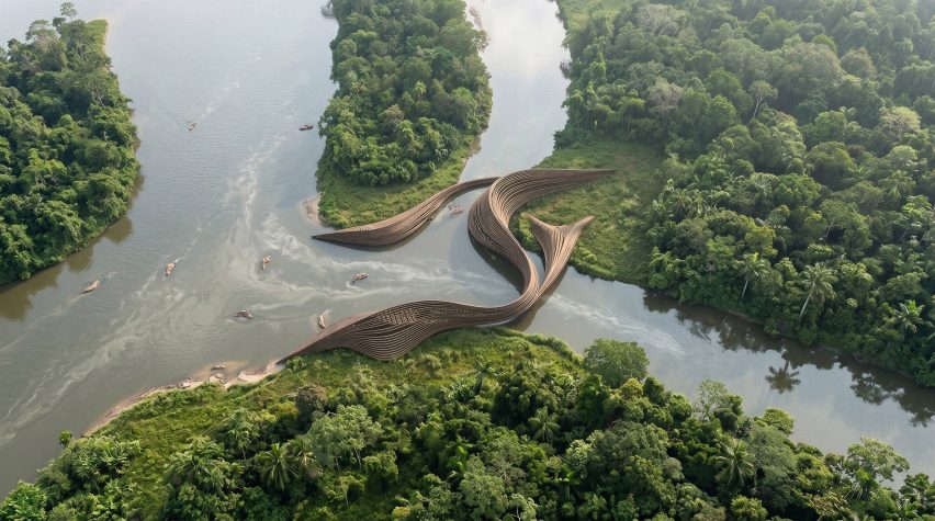 Aerial render of a snaking architectural building that acts as a bridge between three nearby land masses.