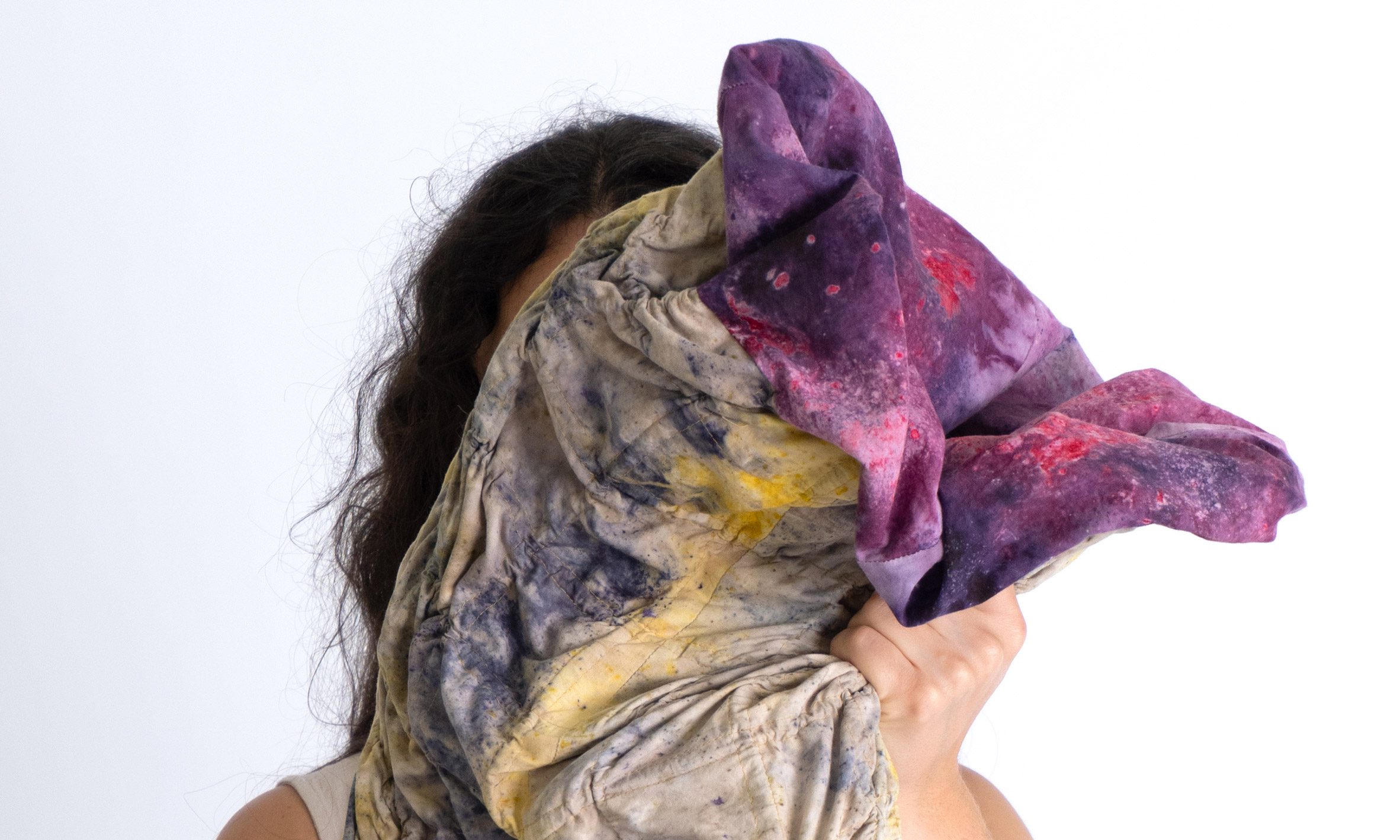 Image of a person holding a piece of folded material.