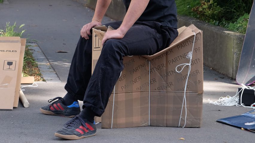 Photo of person sat on a box