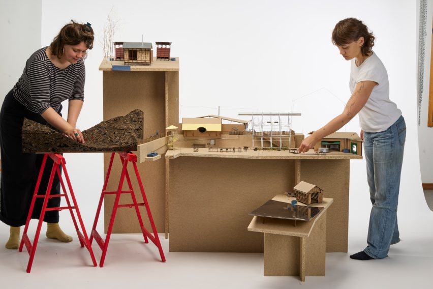 Photo of people with architecture models