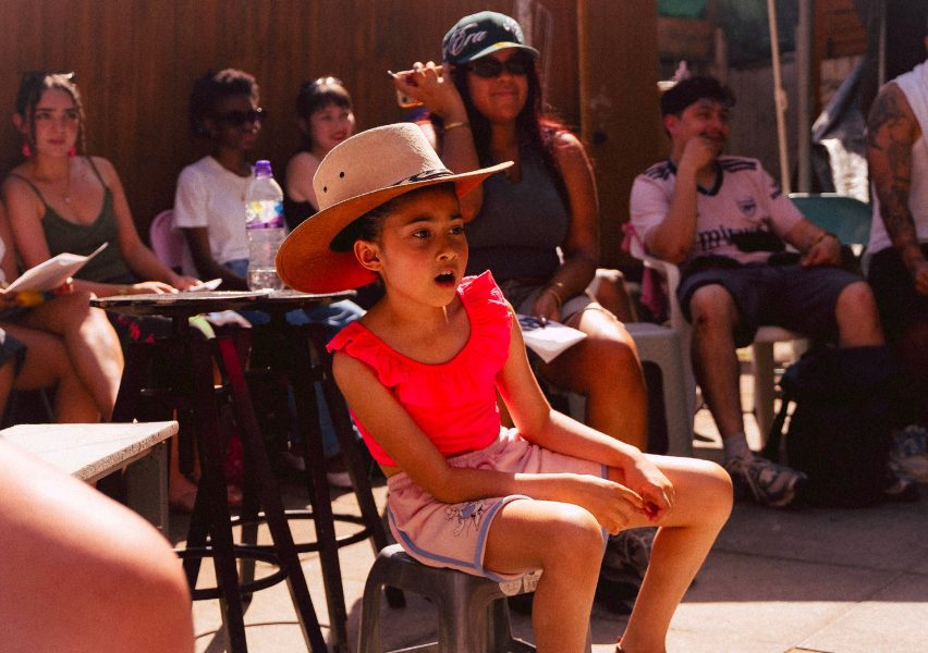 Photo of a child surrounded by other people