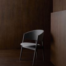 Chair by Stellar Works against wooden background