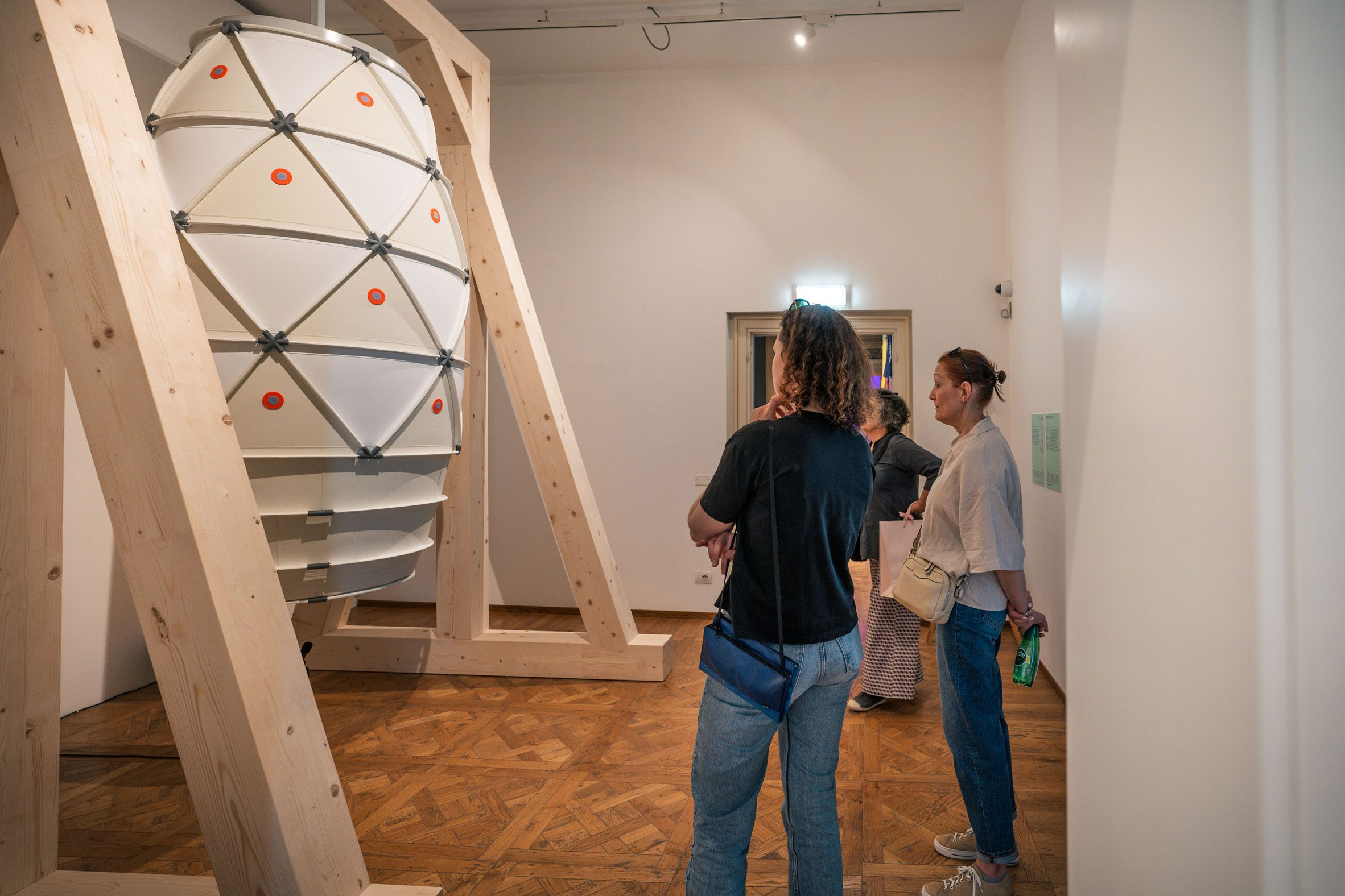 Photo of people looking at an installation