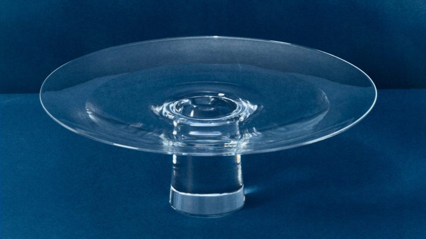 Glass bowl on blue background