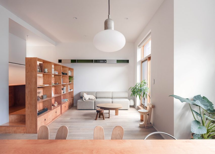 A duplex apartment in Brooklyn renovated using stained birch plywood and stainless steel
